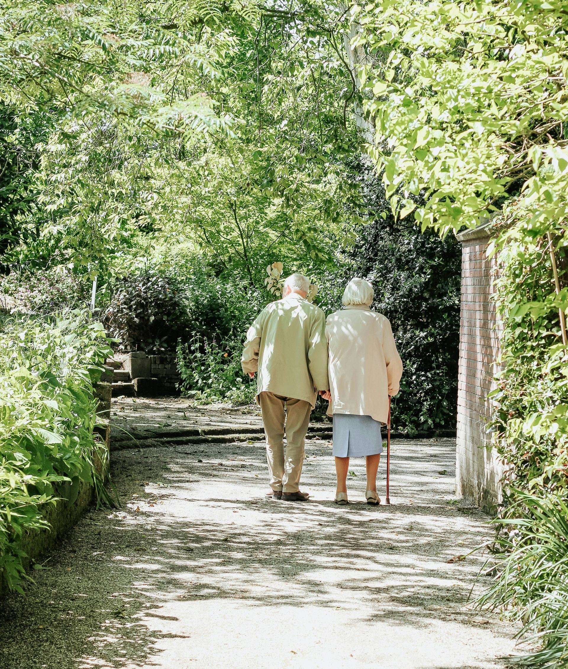 man and woman walking on road during daytime